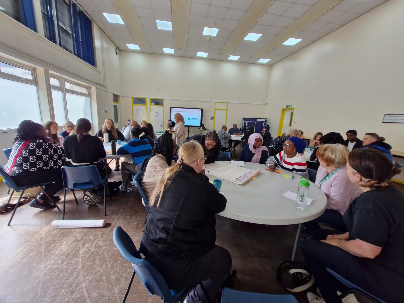 Community members participating in a workshop for underserved communities